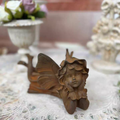 Little angel with chin in hand