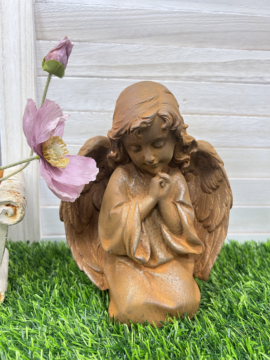 Kneeling and praying angels young