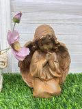 Kneeling and praying angels young