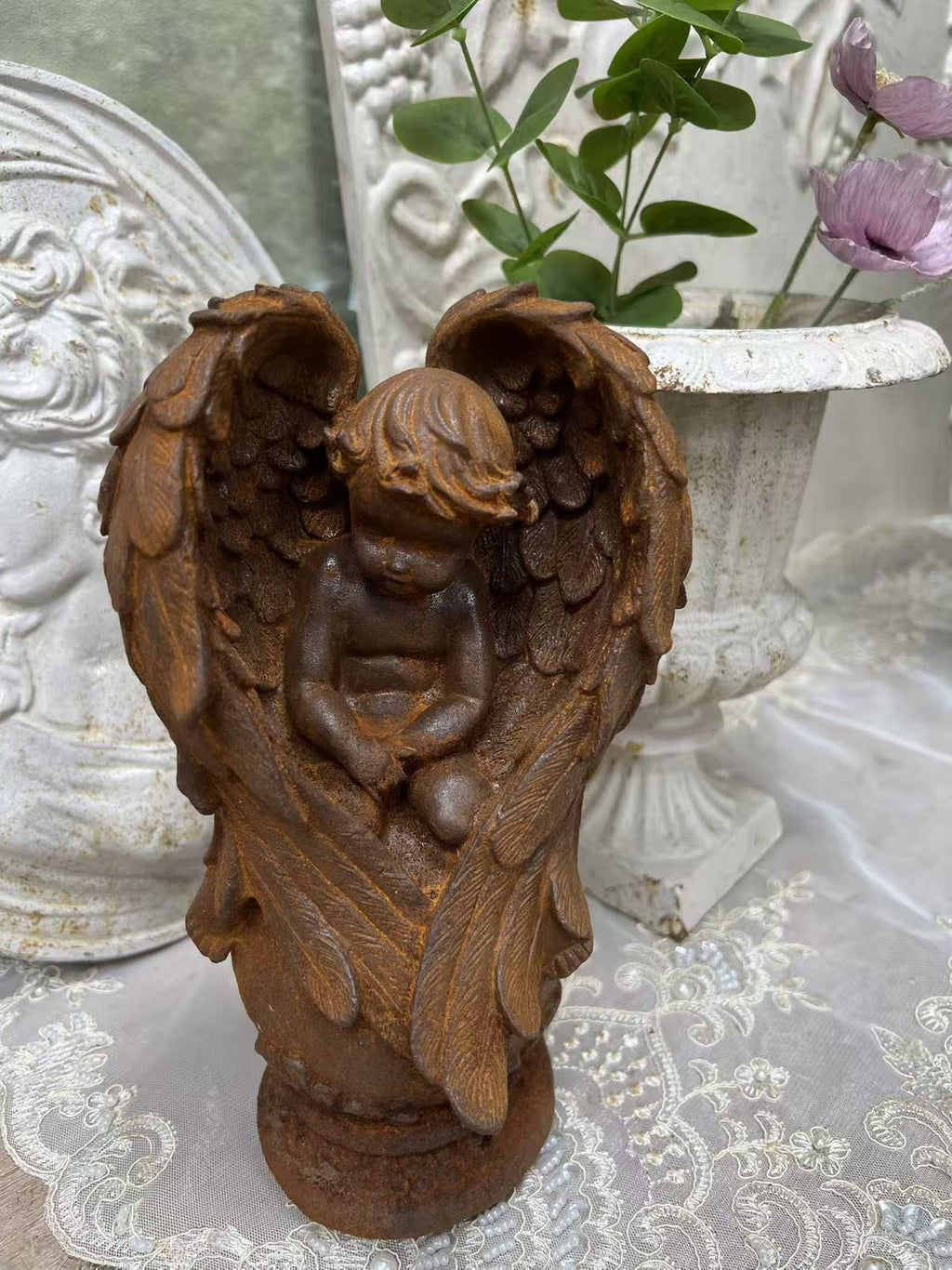 Rusty kneeling prayer angel